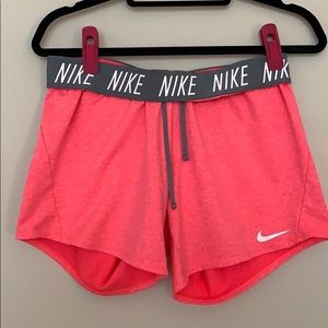 Pink Nike running shorts